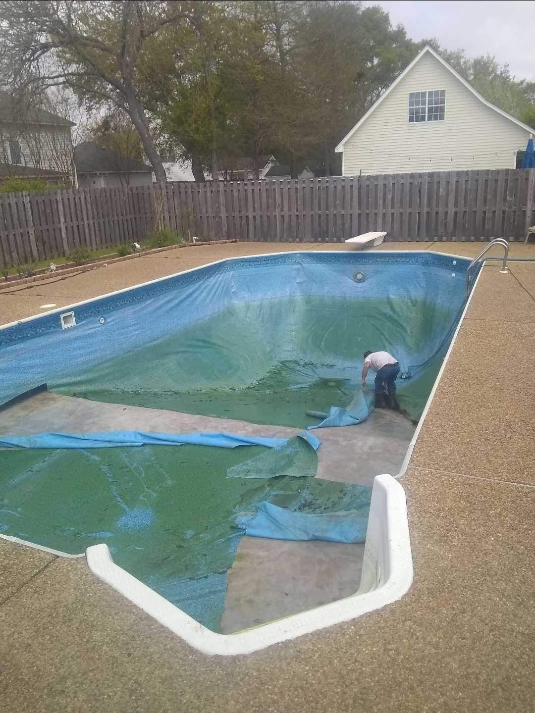 Vinyl pool with the old liner being removed before replacement