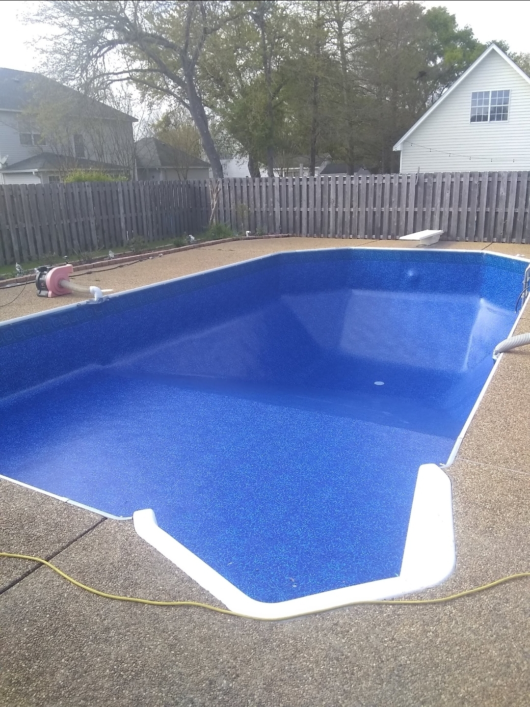The same pool with a new blue vinyl liner installed